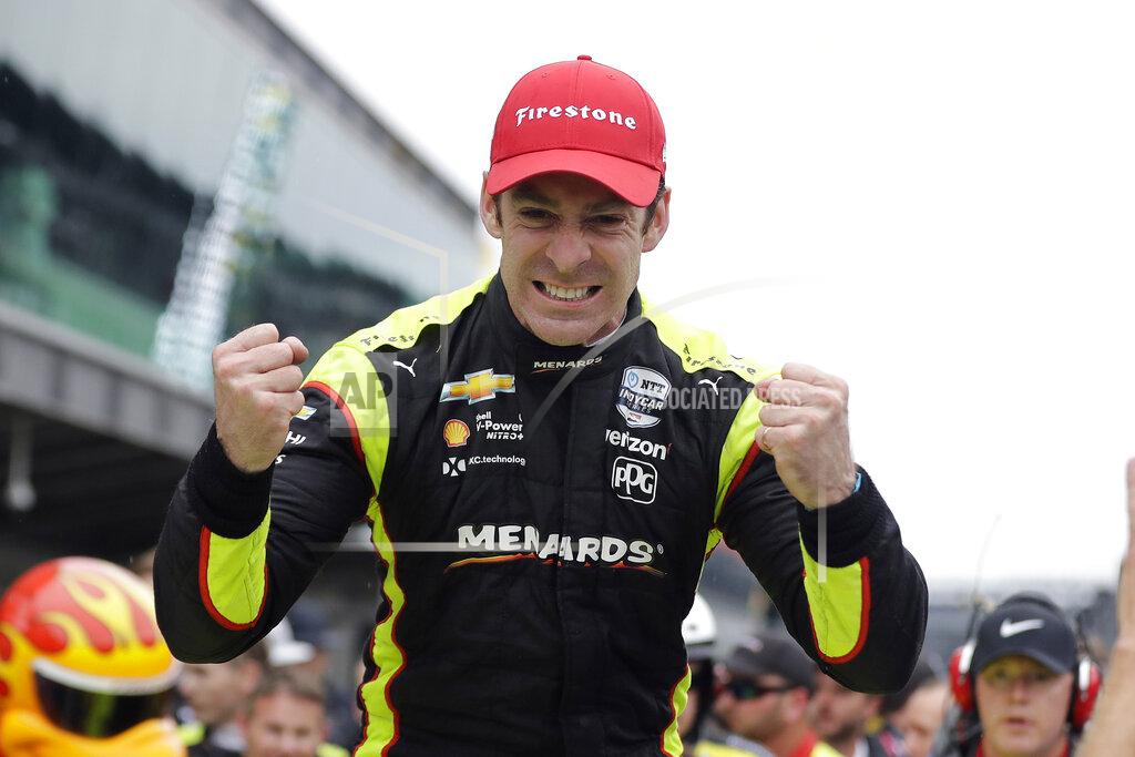 Darron Cummings Simon Pagenaud, of France, celebrates after winning the Indy GP IndyCar auto race at Indianapolis Motor Speedway, Saturday, May 11, 2019, in Indianapolis. (AP Photo/Darron Cummings)