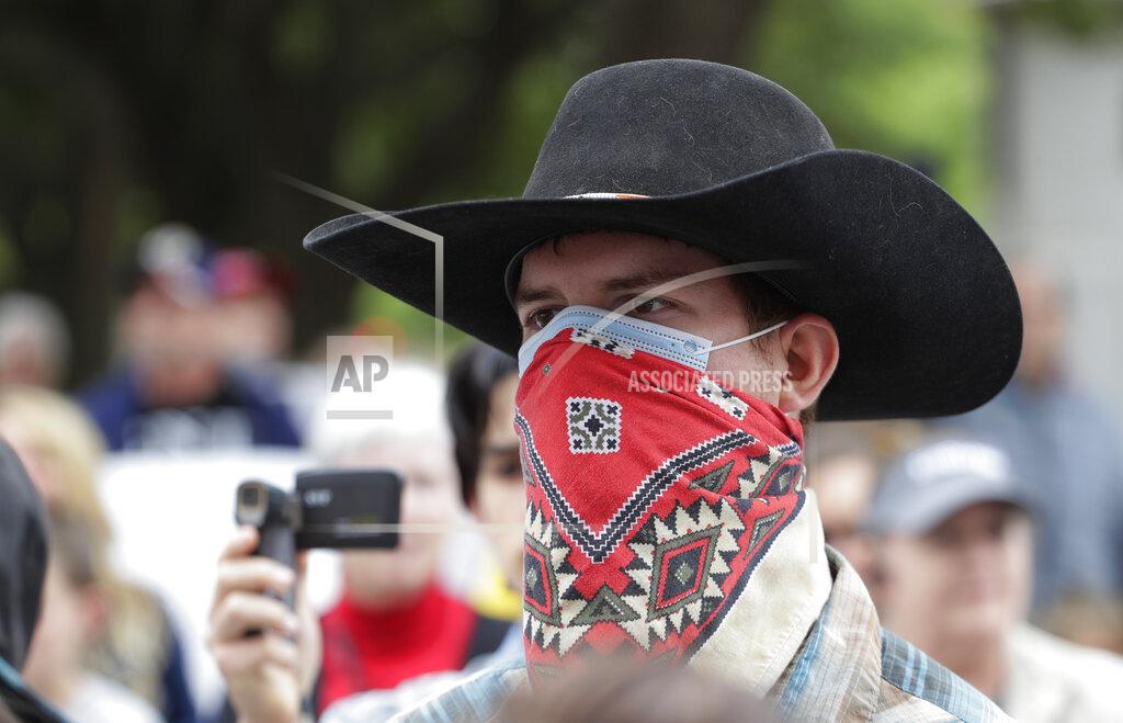 Eric Gay Protesters rally at the Texas State Capitol to speak out against Texas' handling of the COVID-19 outbreak, in Austin, Texas, Saturday, April 18, 2020. Austin and many other Texas cities remain under stay-at-home orders due to the COVID-19 outbreak except for essential personal. (AP Photo/Eric Gay)