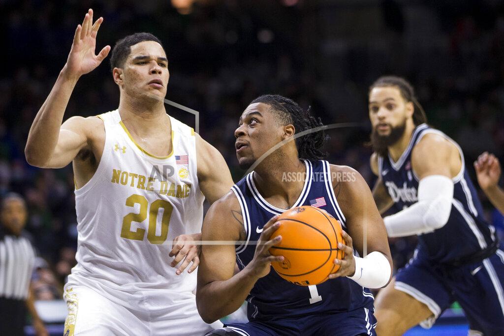 Robert Franklin Duke's Trevor Keels (1) looks to shoot as Notre Dame's Paul Atkinson Jr. (20) defends during the first half of an NCAA college basketball game Monday, Jan. 31, 2022, in South Bend, Ind. (AP Photo/Robert Franklin)