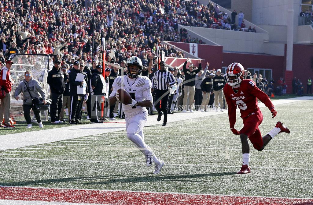 Darron Cummings Purdue's Rondale Moore (4) runs past Indiana's Jonathan Crawford (9) for a touchdown during the second half of an NCAA college football game, Saturday, Nov. 24, 2018, in Bloomington, Ind. Purdue won 28-21. (AP Photo/Darron Cummings)