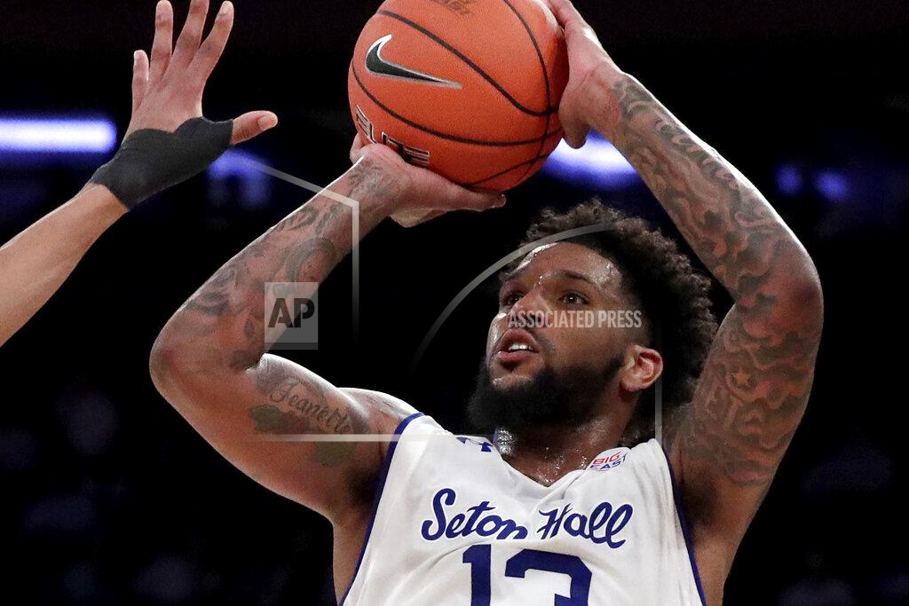 Julio Cortez FILE - In this March 14, 2019, file photo, Seton Hall guard Myles Powell (13) shoots against Georgetown during the first half of an NCAA college basketball game in the Big East men's tournament, in New York. Powell calls it an easy decision to return to Seton Hall and not turn pro. He wants to be the first person in his family to graduate college. The Pirates' star senior guard has Seton Hall atop the Big East preseason conference poll, ending Villanova's five-year run. (AP Photo/Julio Cortez, File)