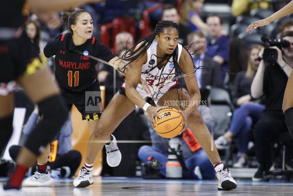 Young Kwak Stanford forward Kiki Iriafen (44) looks to pass as Maryland guard Katie Benzan (11) reaches in during the second half of a college basketball game in the Sweet 16 round of the NCAA tournament, Friday, March 25, 2022, in Spokane, Wash. Stanford won 72-66. (AP Photo/Young Kwak)