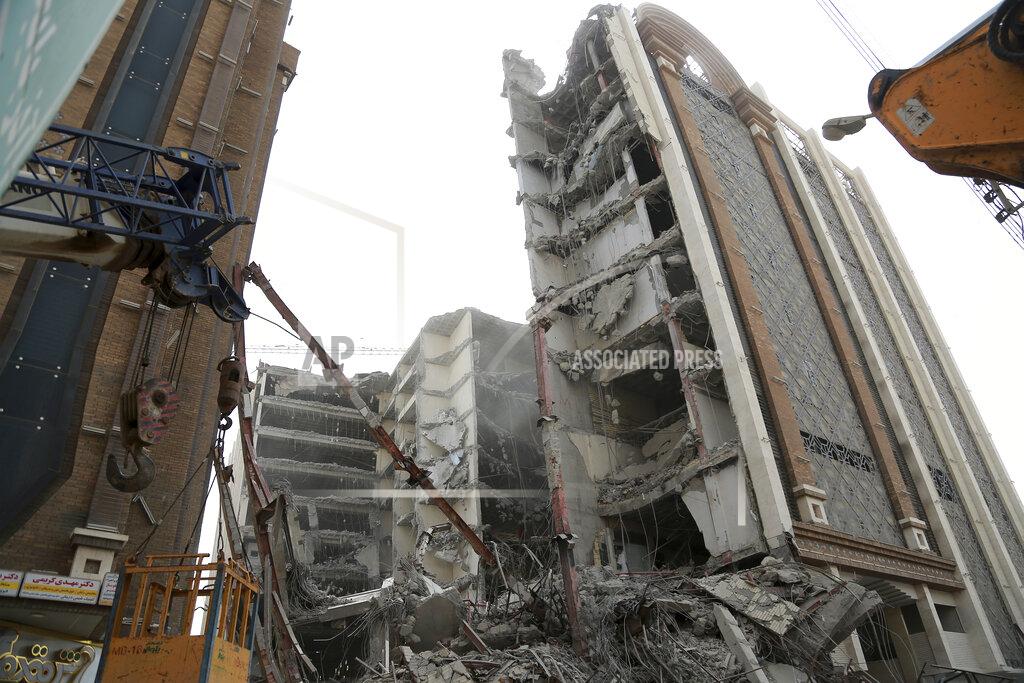 Mohammad Amin Ansari In this photo provided by Fars News Agency, a 10-story commercial building under construction collapsed killing several people in the southwestern city of Abadan, Iran, Monday, May 23, 2022. There are fears the casualty toll could be much higher as more than 80 people were still believed to be trapped under the rubble after the Metropol building toppled, burying shops and even some cars in the surrounding streets, state TV reported. (Mohammad Amin Ansari, Fars News Agency via AP)