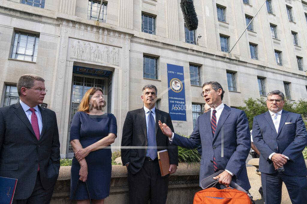 Alex Brandon FILE - In this June 14, 2021 file photo, Bruce Brown, fourth from left, executive director of the Reporters Committee for Freedom of the Press, speaks accompanied by CNN's Washington Bureau Chief Sam Feist, left, Washington Post Executive Editor Sally Buzbee, Washington Post general counsel Jay Kennedy, CNN executive vice president and general counsel David Vigilante, right, after a meeting with Attorney General Merrick Garland at the Department of Justice, in Washington. (AP Photo/Alex Brandon)