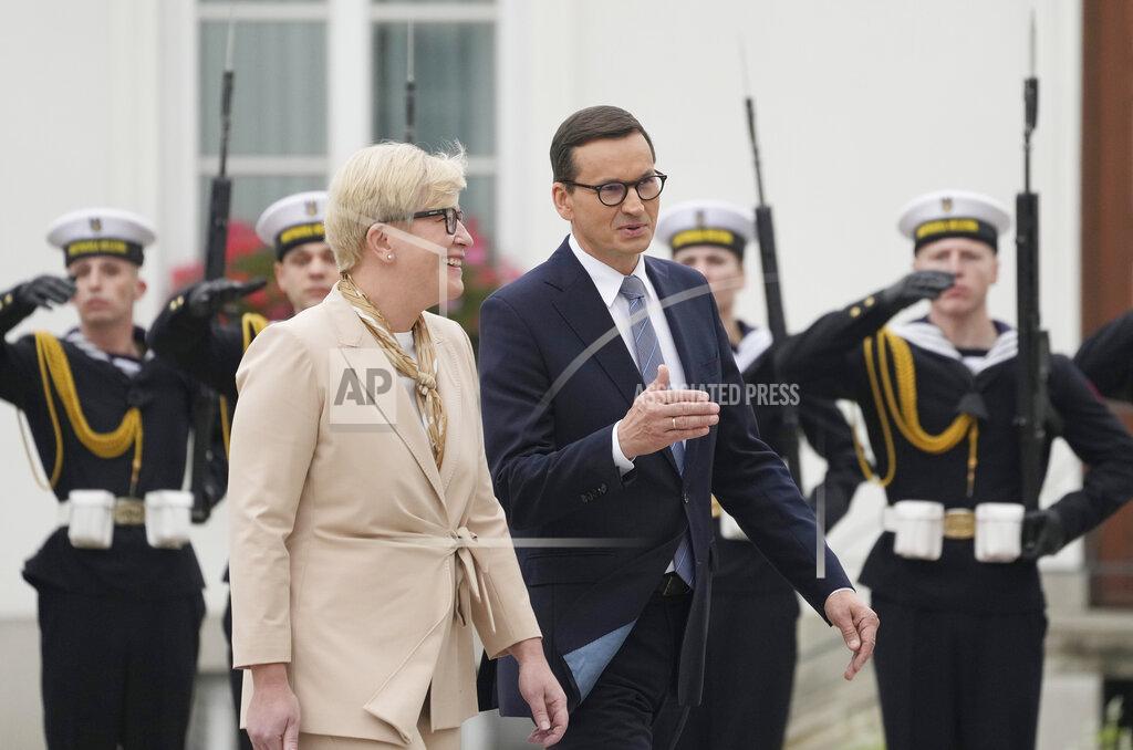 Czarek Sokolowski Lithuanian Prime Minister Ingrida Simonyte, left, being greeted by Poland's Prime Minister Mateusz Morawiecki on a visit for talks that include the region's security in the face of migrant pressure on the two countries' borders with Belarus, in Warsaw, Poland, on Friday, Sept. 17, 2021. (AP Photo/Czarek Sokolowski)