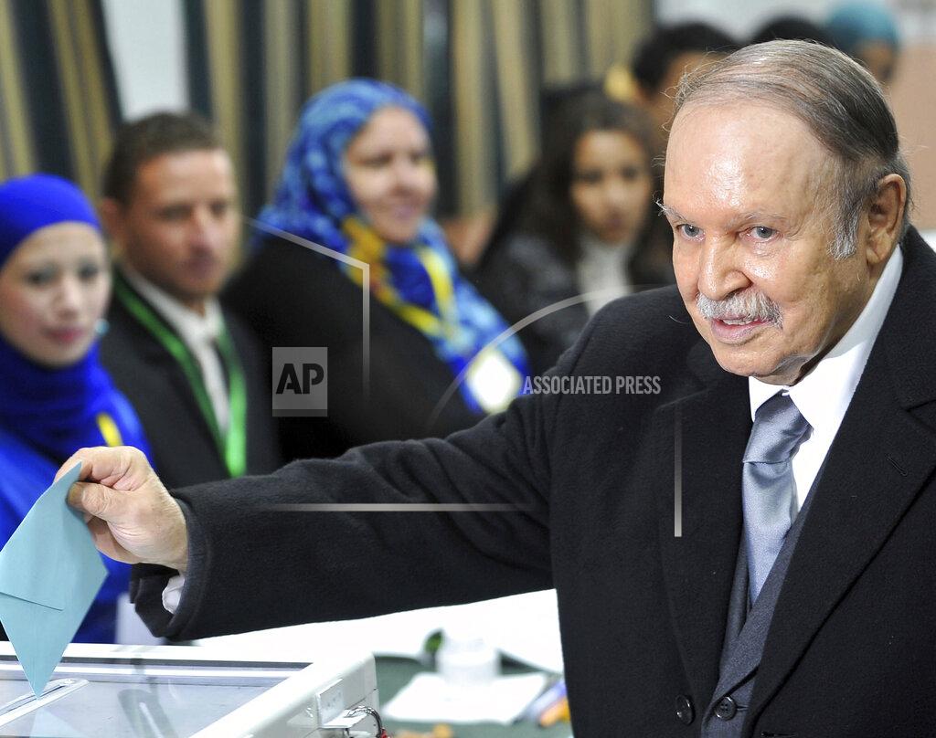 Anis Belghoul FILE -In this Thursday, Nov. 29, 2012, file photo, Algerian President Abdelaziz Bouteflika casts his ballot for local elections in Algiers. Former Algerian President Bouteflika, who fought for independence from France in the 1950s and 1960s and was ousted amid pro-democracy protests in 2019 after 20 years in power, has died at age 84, state television announced Friday, Sept. 17, 2021. (AP Photo/Anis Belghoul, File)