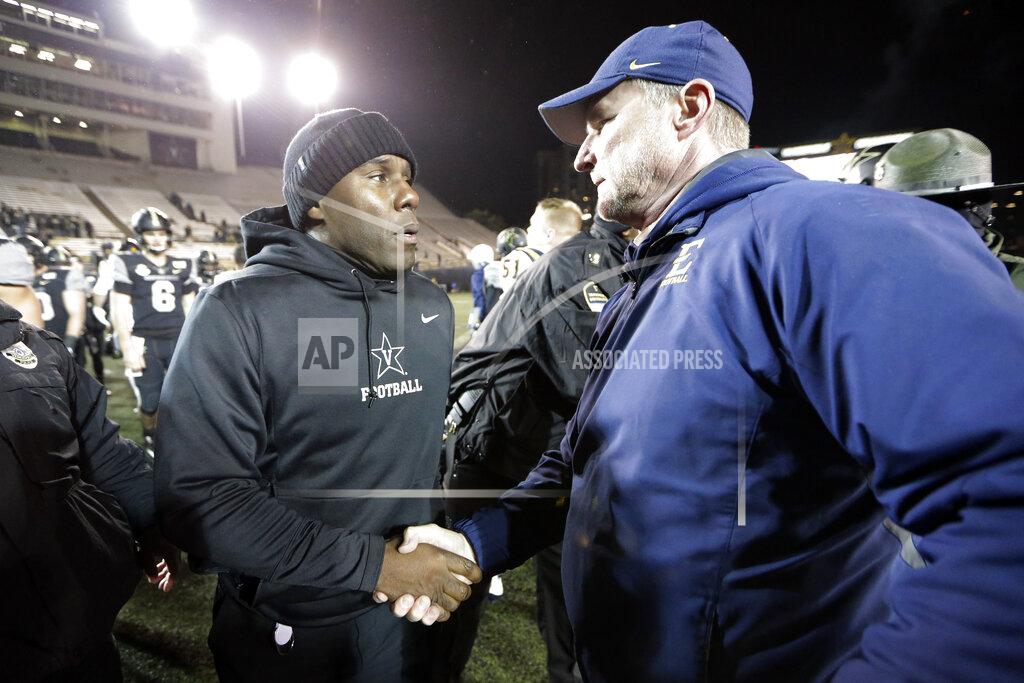 Mark Humphrey Vanderbilt head coach Derek Mason, left, meets ETSU head coach Randy Sanders on the field after an NCAA college football game Saturday, Nov. 23, 2019, in Nashville, Tenn. Vanderbilt won 38-0. (AP Photo/Mark Humphrey)