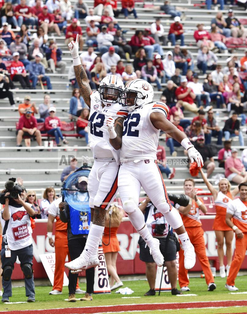 Michael Woods Auburn receiver Jay Jay Wilson (42) and Sam Sherrod (32) celebrate after a touchdown against Arkansas during the second half of an NCAA college football game, Saturday, Oct. 19, 2019 in Fayetteville, Ark. (AP Photo/Michael Woods)