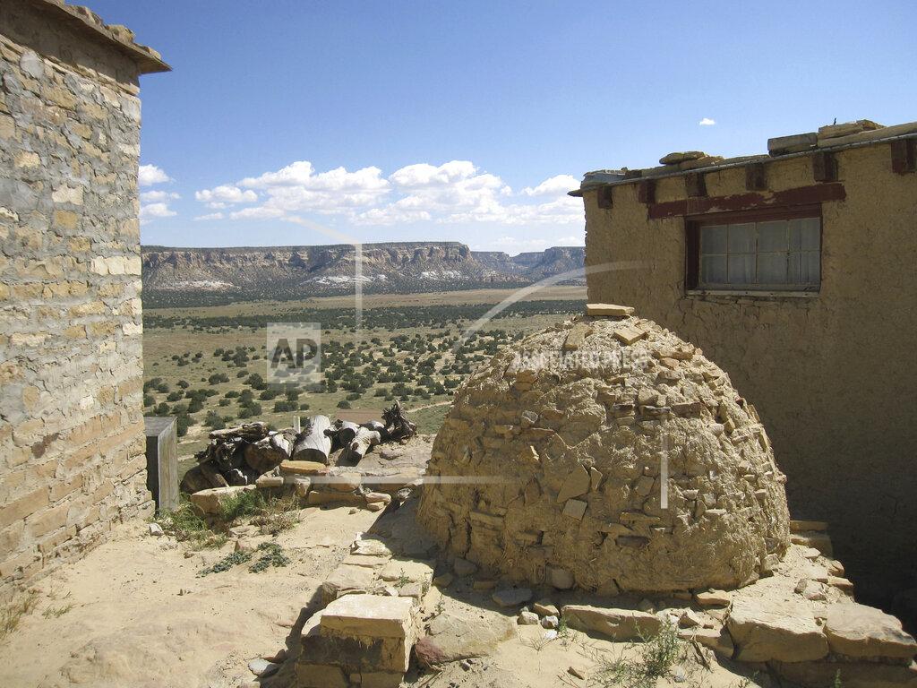 Beth J. Harpaz FILE - This October 2012 photo shows a view from the Acoma Pueblo in New Mexico. The ancient pueblo has been inhabited for centuries by the Acoma people. The location is featured in a collection of mini-essays by American writers published online by the Frommer's guidebook company about places they believe helped shape and define America. (AP Photo/Beth J. Harpaz, File)