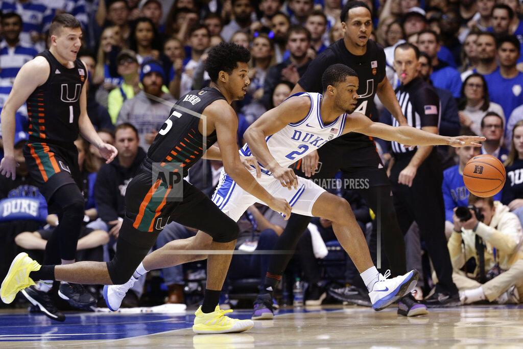 Gerry Broome Miami guard Harlond Beverly (5) and Duke guard Cassius Stanley (2) chase the ball during the first half of an NCAA college basketball game in Durham, N.C., Tuesday, Jan. 21, 2020. (AP Photo/Gerry Broome)