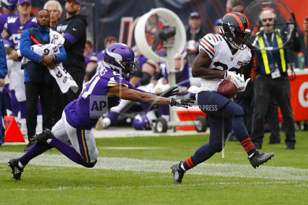Charles Rex Arbogast Chicago Bears running back Tarik Cohen, right, is unable to hold on to a pass as Minnesota Vikings cornerback Mike Hughes defends during the half of an NFL football game Sunday, Sept. 29, 2019, in Chicago. (AP Photo/Charles Rex Arbogast)