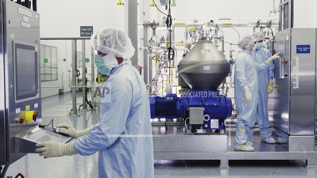 Uncredited FILE - In this undated image from video provided by Regeneron Pharmaceuticals on Friday, Oct. 2, 2020, scientists work with a bioreactor at a company facility in New York state, for efforts on an experimental coronavirus antibody drug. Antibodies are proteins the body makes when an infection occurs; they attach to a virus and help the immune system eliminate it. (Regeneron via AP)