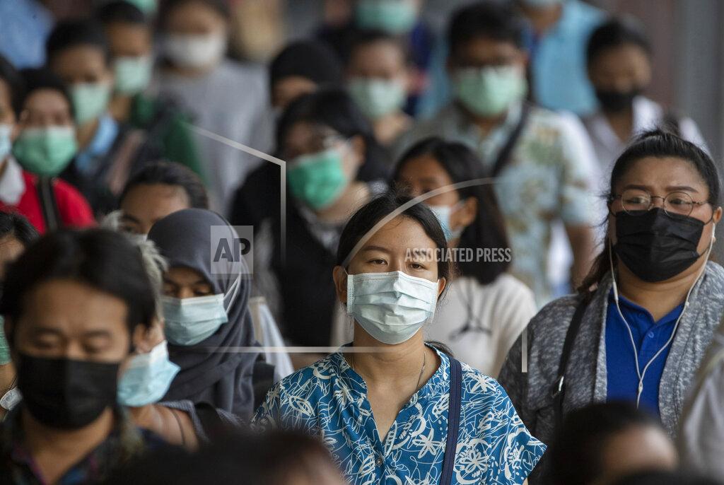 Sakchai Lalit Office workers wearing face masks to help curb the spread of the coronavirus walk to work at Saen Saep pier in Bangkok, Thailand, Friday, April 16, 2021. (AP Photo/Sakchai Lalit)