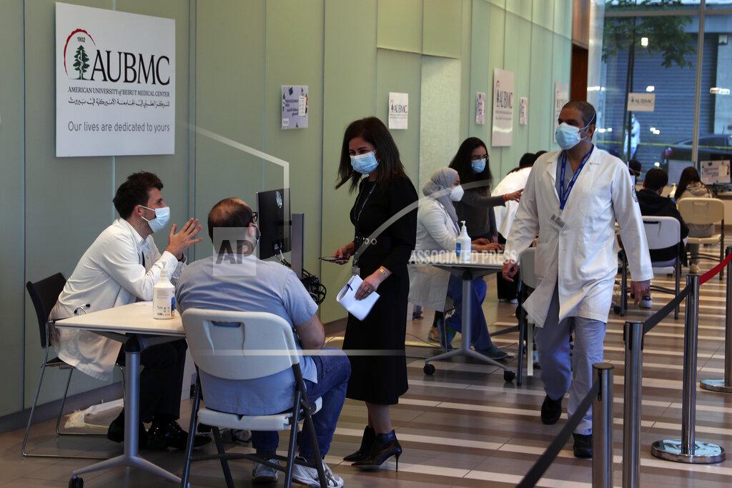 Bilal Hussein Frontline medical workers start registration process to get the Pfizer-BioNTech COVID-19 vaccine during a nationwide vaccination program at the American University Medical Center in Beirut, Lebanon, Sunday, Feb. 14, 2021. (AP Photo/Bilal Hussein)