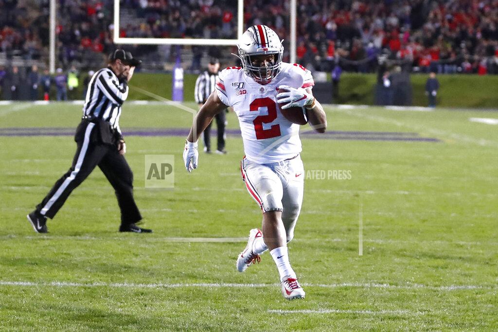 Charles Rex Arbogast Ohio State running back J.K. Dobbins scores on a pass from quarterback Justin Fields during the first half of an NCAA college football game against Northwestern, Friday, Oct. 18, 2019, in Evanston, Ill. (AP Photo/Charles Rex Arbogast)