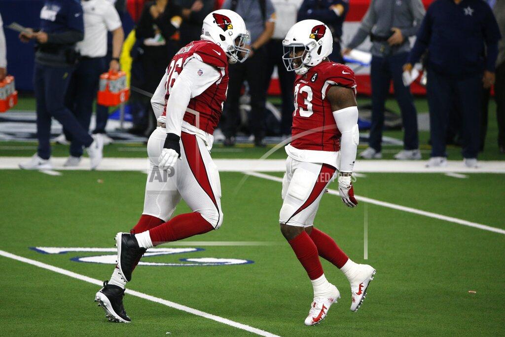 Michael Ainsworth Arizona Cardinals' Angelo Blackson (96) and Haason Reddick (43) celebrate their combined effort to sack Dallas Cowboys quarterback Andy Dalton (14) in the first half of an NFL football game in Arlington, Texas, Monday, Oct. 19, 2020. (AP Photo/Michael Ainsworth)