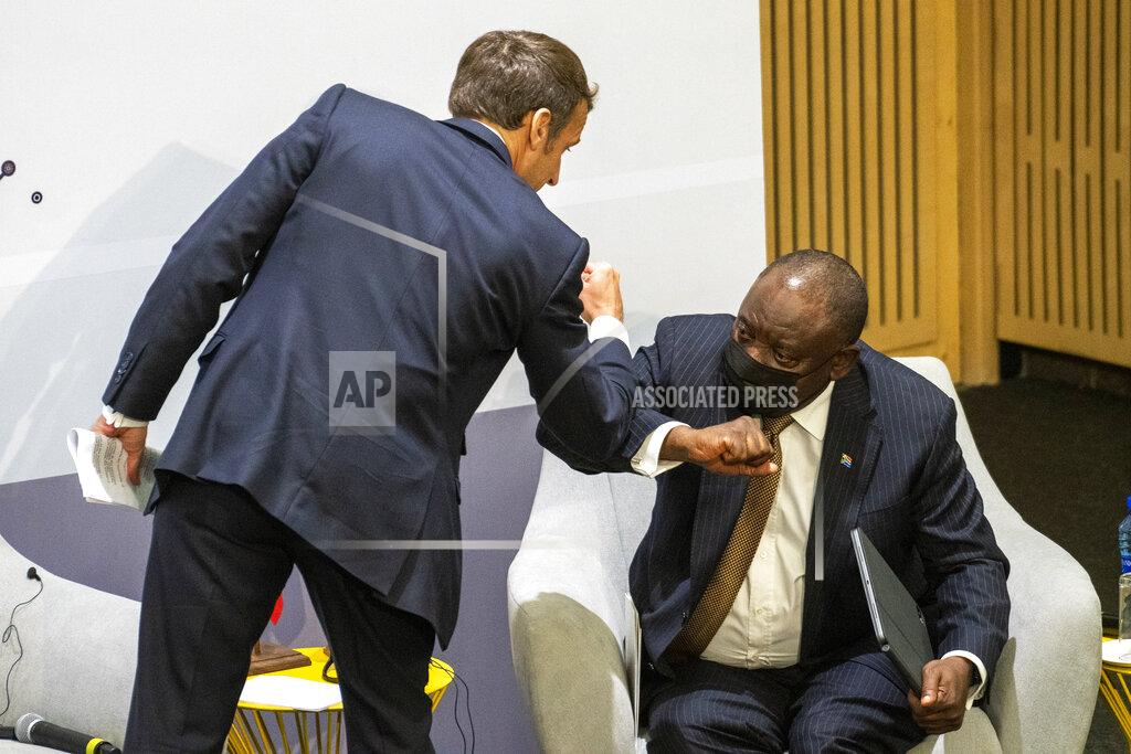 Jerome Delay French President Emmanuel Macron is congratulated by South African President Cyril Ramaphosa after giving a speech at the University of Pretoria Future Africa in Pretoria, South Africa, Friday May 28, 2021. Macron Ramaphosa are launching a program to support African vaccine production, a project backed by the European Union, the United States and the World Bank. (AP Photo/Jerome Delay)