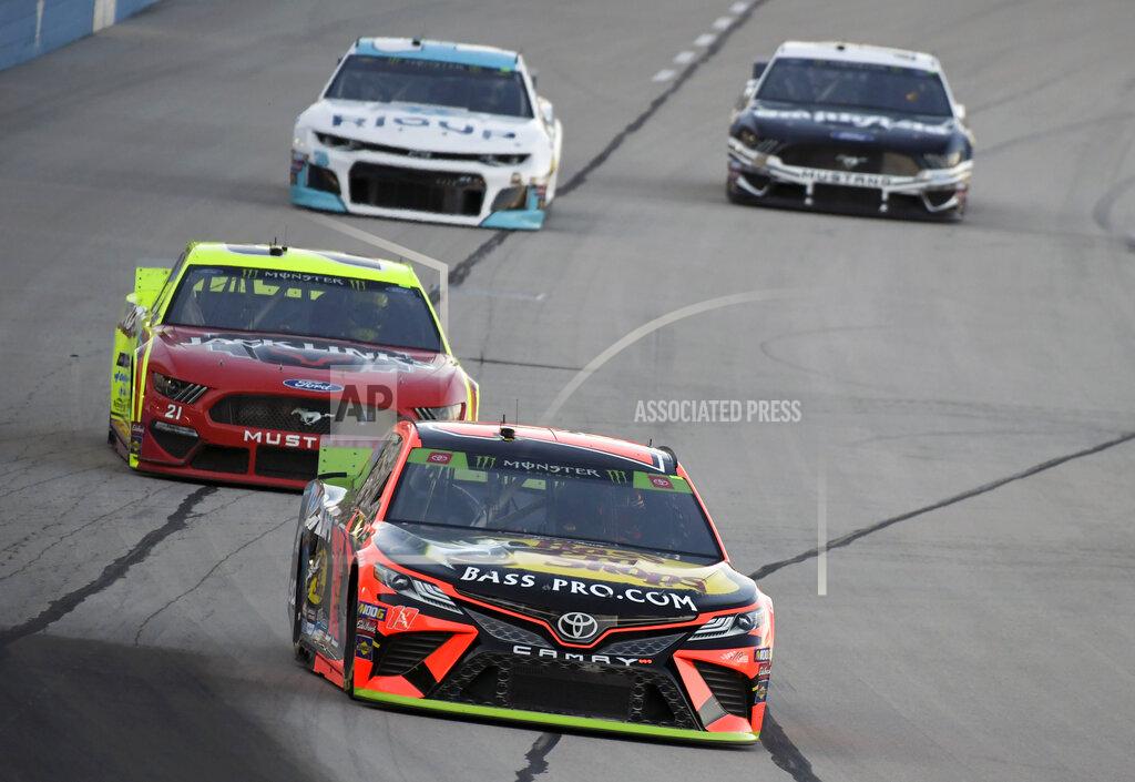 Larry Papke Martin Truex Jr. leads drivers into Turn 1 during practice for the NASCAR Cup Series auto race at Texas Motor Speedway in Forth Worth, Texas, Friday, Nov. 1, 2019. (AP Photo/Larry Papke)