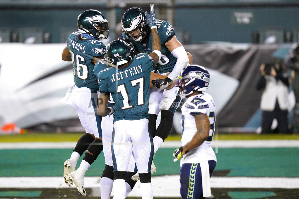 Chris Szagola Philadelphia Eagles' Dallas Goedert (88) celebrates with Alshon Jeffery (17) and Miles Sanders (26) after scoring a touchdown during the first half of an NFL football game against the Seattle Seahawks, Monday, Nov. 30, 2020, in Philadelphia. (AP Photo/Chris Szagola)