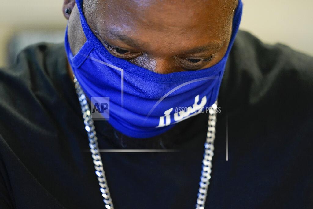 Darron Cummings Larry Brown concentrates during his occupational therapy session at Community Health Network, Thursday, Aug. 20, 2020, in Indianapolis. Brown isn’t sure how far recovery from COVID-19 will take him. “My expectations are ... they're, I don’t know,” he says. “I haven’t set the bar high, and I haven’t set the bar low. I just accept, you know, making progress.” (AP Photo/Darron Cummings)