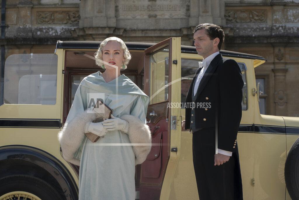 Ben Blackall This image released by Focus Features shows Laura Haddock, left, and Michael Fox in a scene from "Downton Abbey: A New Era." (Ben Blackall/Focus Features via AP)