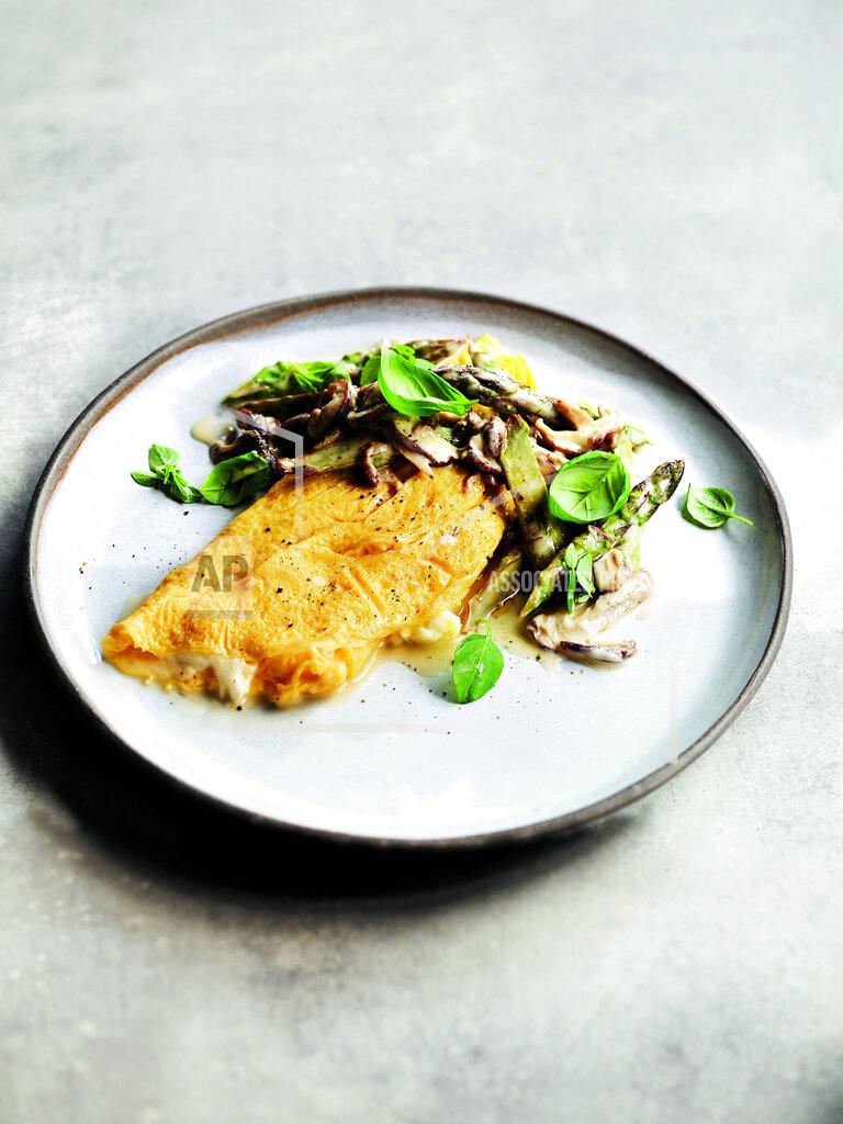 Jamie Orlando Smith This image released by Hachette Book Group shows a recipe for mozzarella and basil omelette with asparagus and shiitake mushrooms from Gordon Ramsay's new book "Ramsay in 10: Delicious Recipes Made in a Flash". (Jamie Orlando Smith/Hachette Book Group via AP)