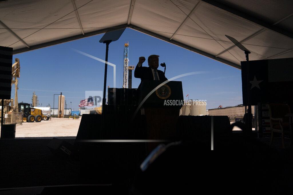 Evan Vucci President Donald Trump delivers remarks about American energy production during a visit to the Double Eagle Energy Oil Rig, Wednesday, July 29, 2020, in Midland, Texas. (AP Photo/Evan Vucci)