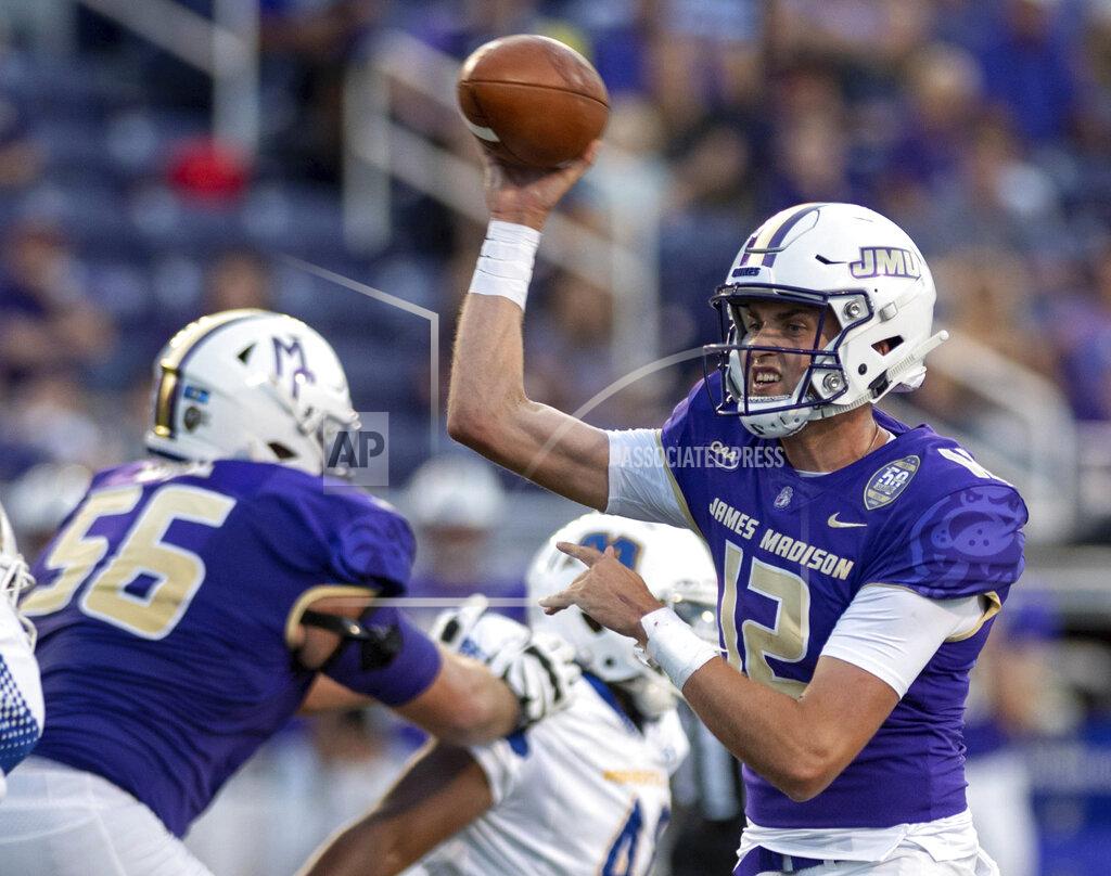 Daniel Lin James Madison quarterback Cole Johnson (12) throws a pass during the first half against Morehead State in an NCAA college football game in Harrisonburg, Va., Saturday, Sept. 4, 2021. (Daniel Lin/Daily News-Record via AP)