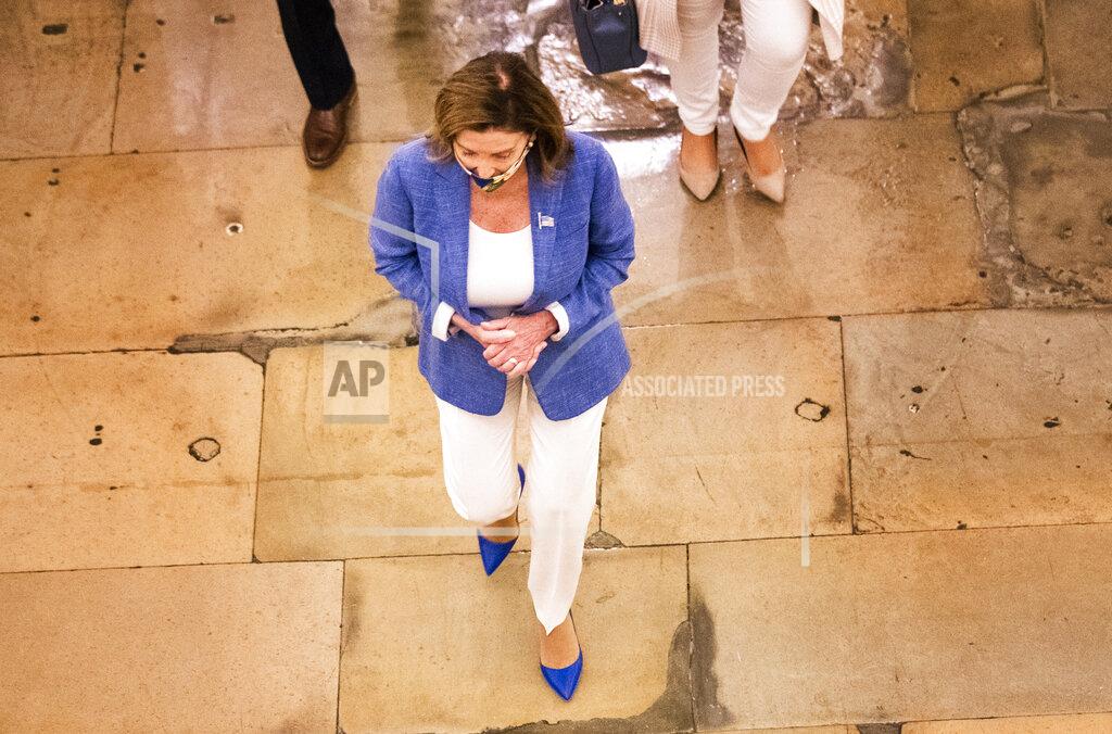 Manuel Balce Ceneta House Speaker Nancy Pelosi walks towards her office at the Capitol to resume talks with White House chief of staff Mark Meadows and Treasury Secretary Steven Mnuchin on a COVID-19 relief bill, Saturday, Aug. 1, 2020, in Washington. (AP Photo/Manuel Balce Ceneta)