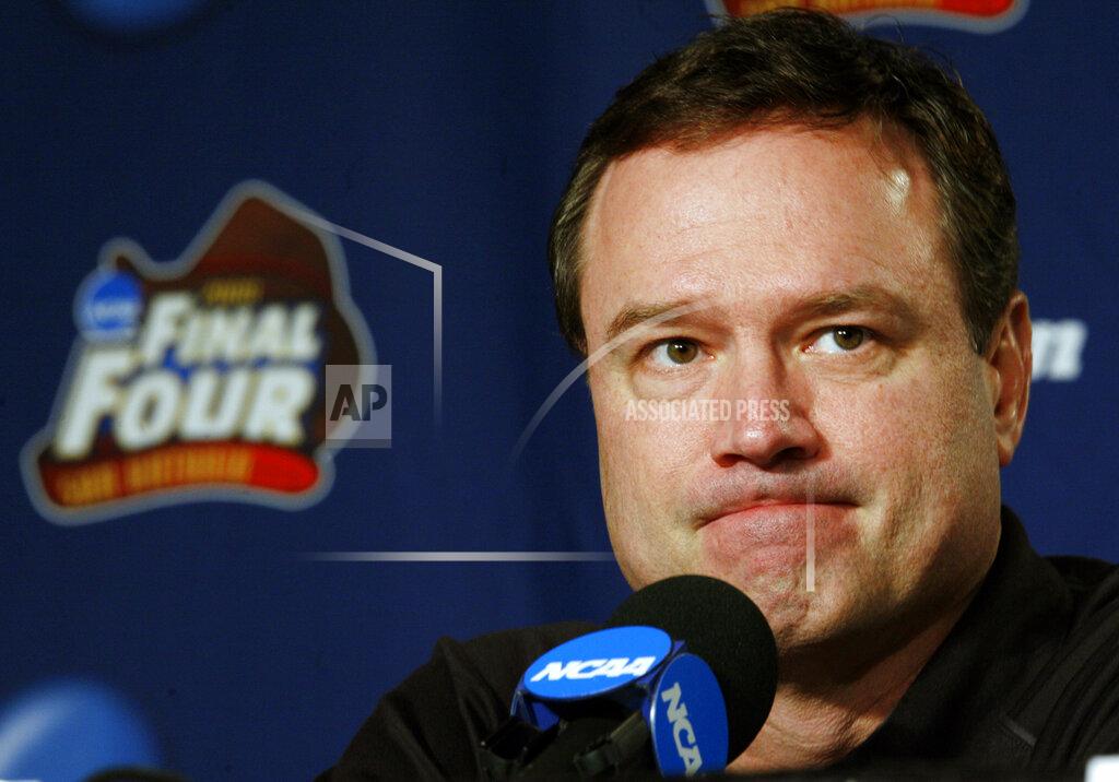 Charlie Neibergall FILE - In this Sunday, April 6, 2008, file photo, Kansas head coach Bill Self listens to a question at a news conference before Monday's championship game against Memphis at the NCAA college basketball Final Four in San Antonio. The NCAA and networks across the sports dial have infused fans with a hoops fix by rebroadcasting epic NCAA Tournament games. Coaches and players involved in those games are adding insight and a dash of humor by live tweeting during the replay. (AP Photo/Charlie Neibergall, File)