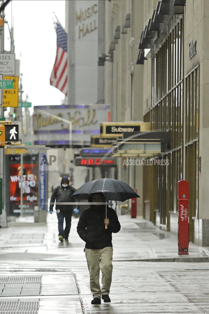 Frank Franklin Ii Pedestrians walk a mostly empty Sixth Avenue during the coronavirus outbreak, Friday, April 3, 2020, in New York. The new coronavirus causes mild or moderate symptoms for most people, but for some, especially older adults and people with existing health problems, it can cause more severe illness or death. (AP Photo/Frank Franklin II)