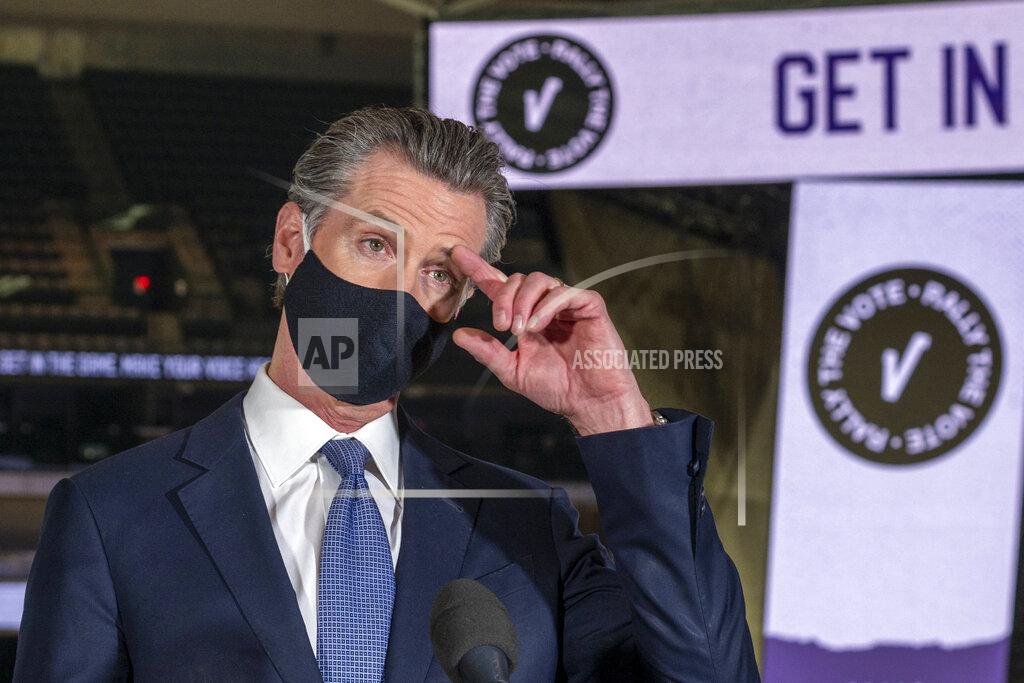 Renée C. Byer FILE - In this Oct 29, 2020, file photo, California Gov. Gavin Newsom speaks to reporters at Golden 1 Center in Sacramento, Calif. Gov. Newsom is facing a possible recall election as the nation's most populous state struggles to emerge from the coronavirus crisis. Organizers say they have collected more than half of the nearly 1.5 million petition signatures needed to place the recall on the ballot. (Renée C. Byer/The Sacramento Bee via AP, Pool, File)