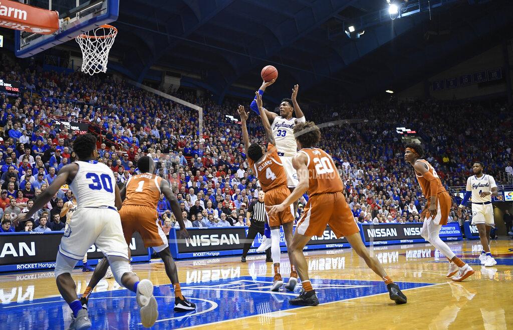 Reed Hoffmann Kansas Jayhawks forward David McCormack (33) shoots over the Texas defense during the second half of an NCAA college basketball game in Lawrence, Kan., Monday, Feb. 3, 2020. (AP Photo/Reed Hoffmann)