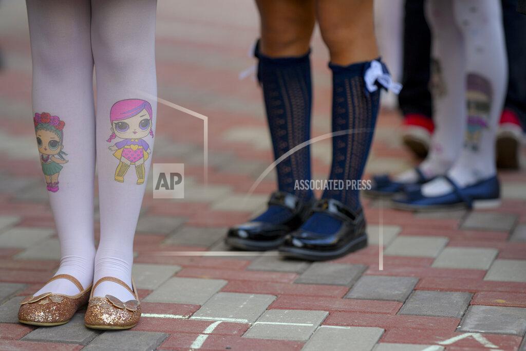 Andreea Alexandru Children take part in festivities marking the beginning of the school year at a school in Bucharest, Romania, Monday, Sept. 13, 2021. Children returned to classrooms in Romania, a country with one of the lowest COVID-19 vaccination rates in the European Union, as the daily infection numbers continue to rise. (AP Photo/Andreea Alexandru)
