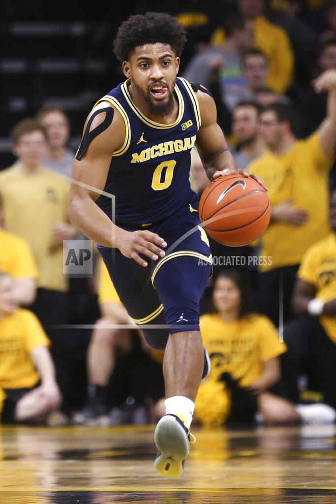 Rebecca F. Miller Michigan guard David DeJulius brings the ball up during the first half of an NCAA college basketball game against Iowa on Friday, Jan. 17, 2020, in Iowa City, Iowa. (Rebecca F. Miller/The Gazette via AP)
