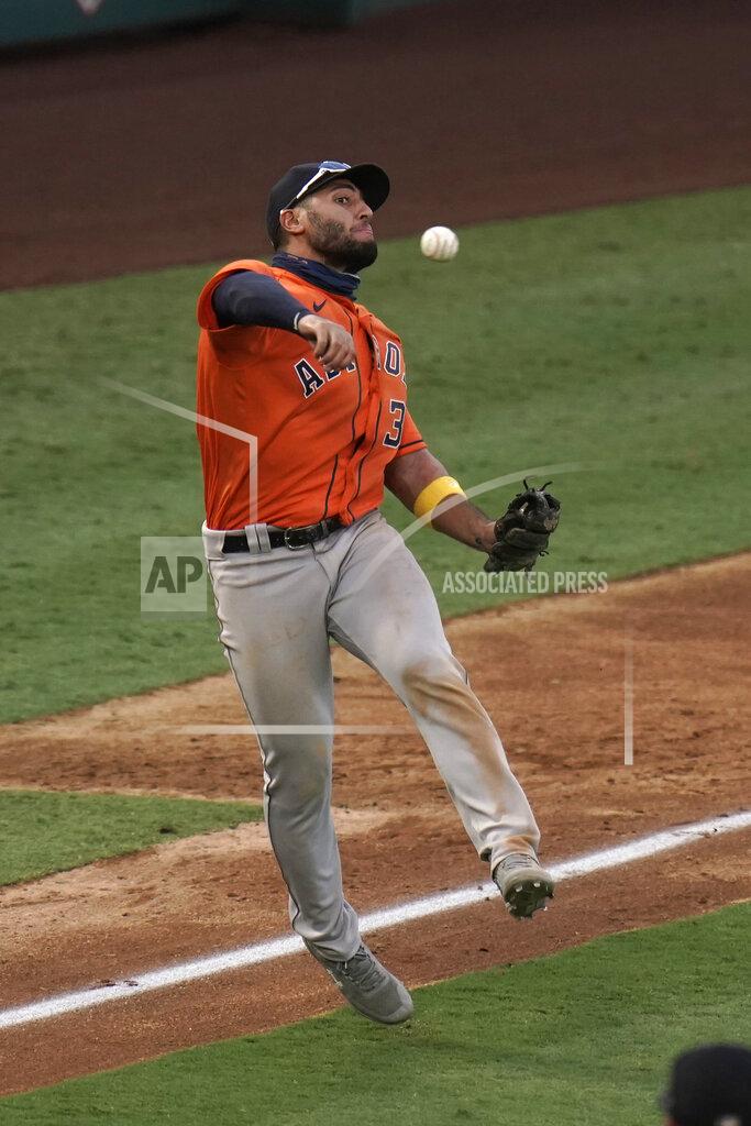 Jae C. Hong Houston Astros third baseman Abraham Toro throws the ball to first base to throw out Los Angeles Angels' Jared Walsh during the sixth inning of the first baseball game of a doubleheader, Saturday, Sept. 5, 2020, in Anaheim, Calif. (AP Photo/Jae C. Hong)