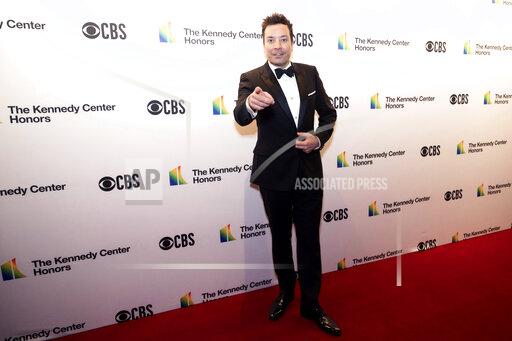 FILE - Jimmy Fallon poses on the red carpet at the honors gala for the 44th Kennedy Center Honors on Sunday, Dec. 5, 2021, in Washington. On Tuesday, Dec. 7 Fallon will release his holiday single "It Was A… (Masked Christmas)," featuring Ariana Grande and Megan Thee Stallion. (AP Photo/Kevin Wolf, File)