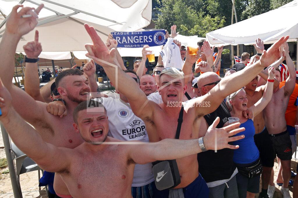 Angel Fernandez Glasgow Rangers supporters cheer outside a bar in downtown Seville, Spain, Tuesday, May 17, 2022. Eintracht Frankfurt will play Glasgow Rangers in the Europa League final Wednesday evening in Seville. (AP Photo/Angel Fernandez)
