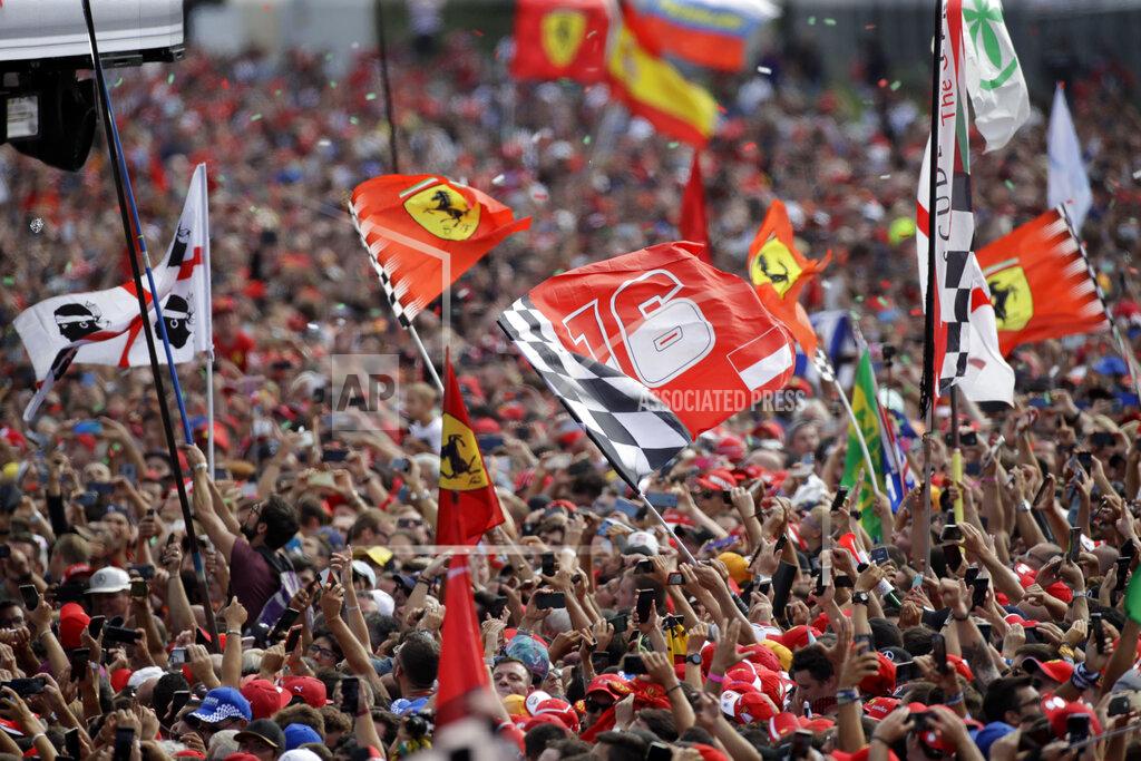 Luca Bruno Ferrari fans celebrates after Ferrari driver Charles Leclerc of Monaco winning the Formula One Italy Grand Prix at the Monza racetrack, in Monza, Italy, Sunday, Sept. 8, 2019. (AP Photo/Luca Bruno)