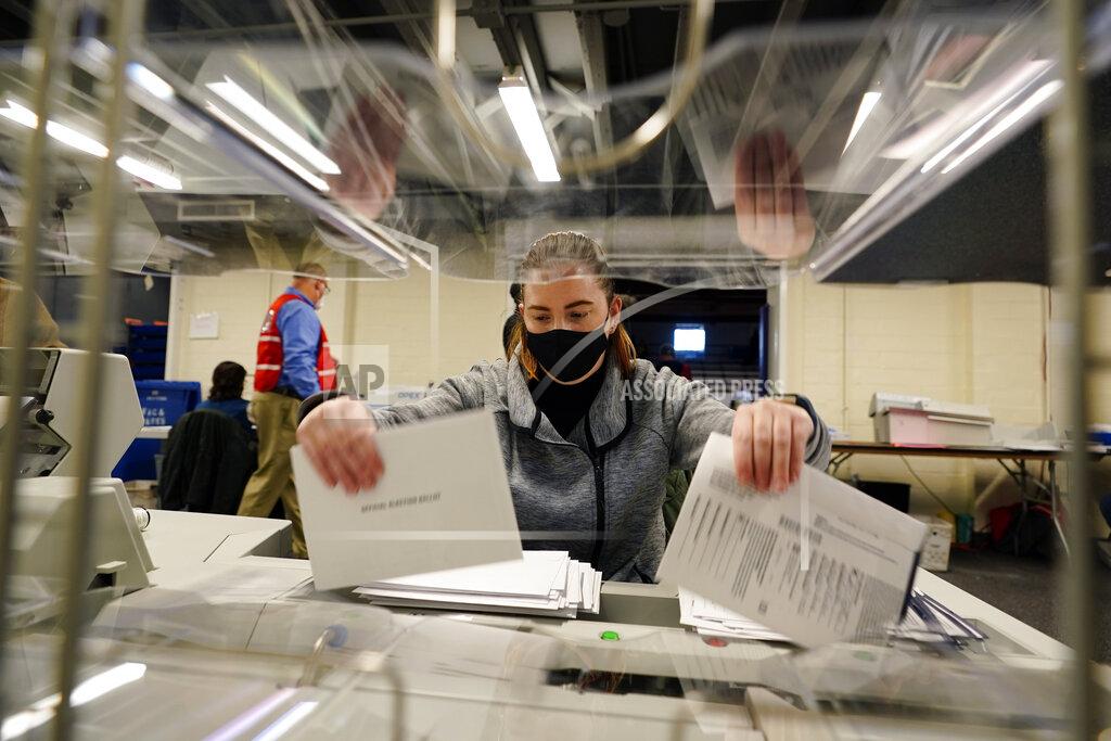 Matt Slocum Chester County, Pa., election worker Kristina Sladek opens mail-in and absentee ballots for the 2020 General Election in the United States at West Chester University, Tuesday, Nov. 3, 2020, in West Chester, Pa. (AP Photo/Matt Slocum)