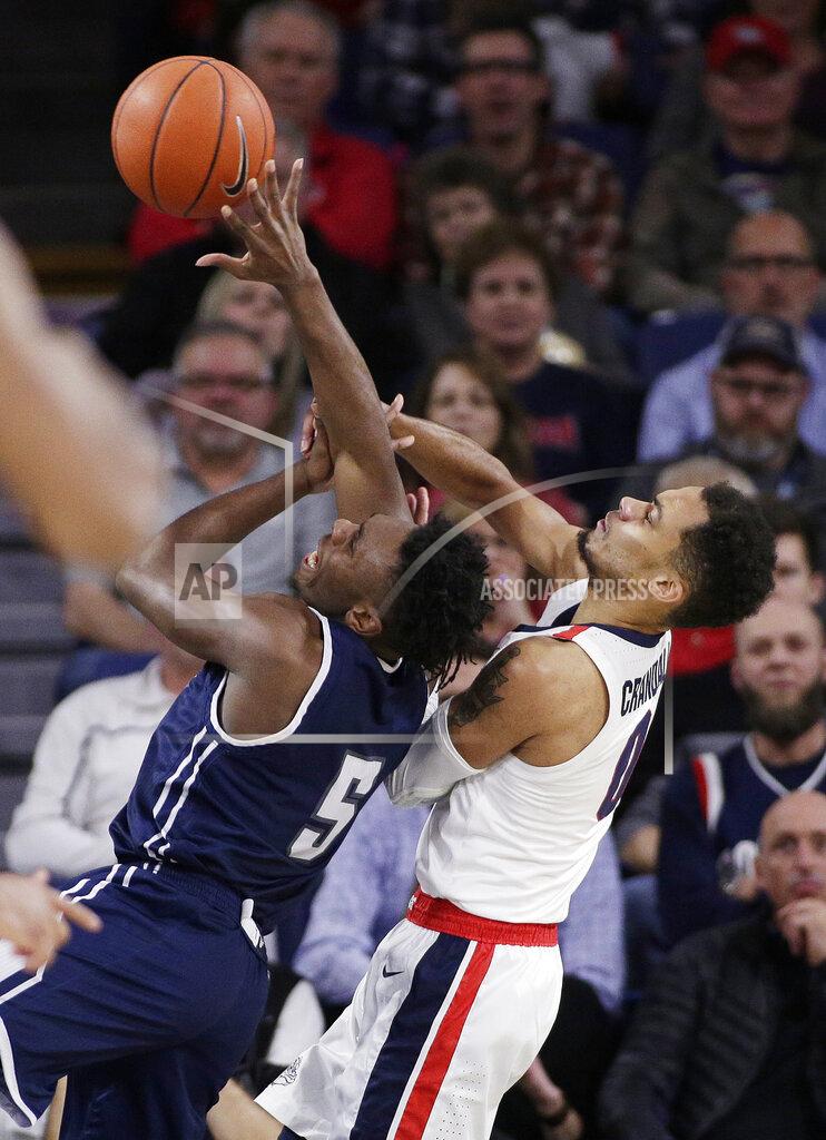 Young Kwak Loyola Marymount guard James Batemon (5) shoots and is fouled by Gonzaga guard Geno Crandall during the second half of an NCAA college basketball game in Spokane, Wash., Thursday, Jan. 17, 2019. Gonzaga won 73-55. (AP Photo/Young Kwak)