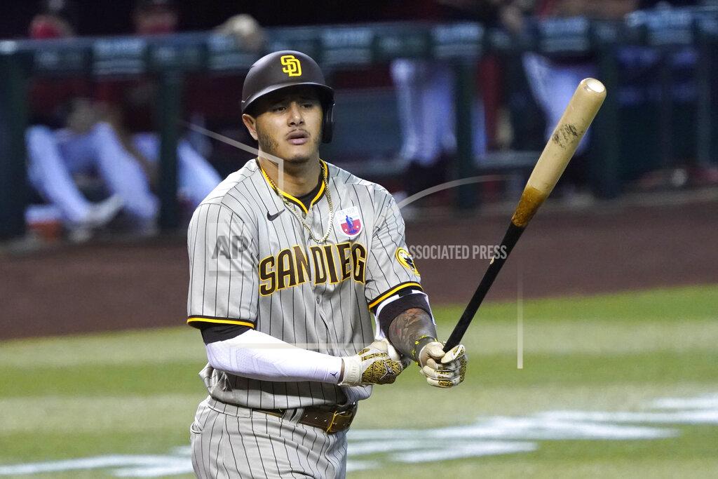 Rick Scuteri San Diego Padres' Manny Machado reacts after drawing a walk against the Arizona Diamondbacks in the first inning during a baseball game, Sunday, Aug 16, 2020, in Phoenix. (AP Photo/Rick Scuteri)