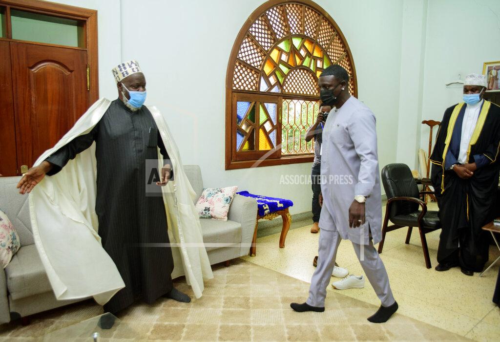 Nicholas Bamulanzeki Senegalese - American performer Akon, right, is welcomed by the Mufti of Uganda, Shiekh Shaban Mubajje, at the Gaddafi National mosque, in Kampala, Uganda, Friday, April 2, 2021. Akon is visiting Uganda Friday in search of investment opportunities that would extend his business footprint in Africa, where his efforts include a planned futuristic city in his native Senegal. Akon’s arrival in the East African country was announced by the Ministry of Foreign Affairs. (AP Photo/ Nicholas Bamulanzeki)
