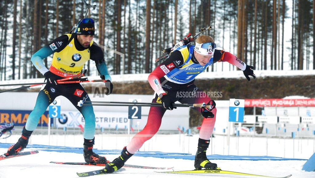 Jussi Nukari Martin Fourcade, left of France and Johannes Thingnes Boe of Norway compete during the men's 12,5 km Pursuit competition, at the IBU Biathlon World Cup in Kontiolahti, Finland, Saturday March 14, 2020. (Jussi Nukari/Lehtikuva via AP)