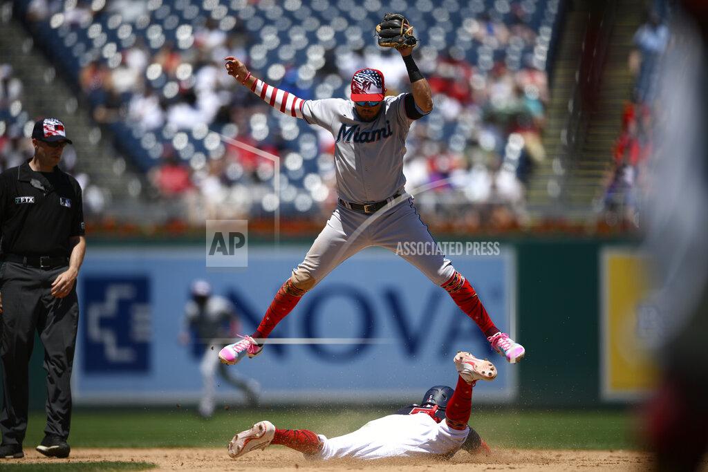 Nick Wass Washington Nationals' Ehire Adrianza, bottom, steals second against Miami Marlins shortstop Miguel Rojas, top, during the eighth inning of a baseball game, Monday, July 4, 2022, in Washington. The Marlins won 3-2 in ten innings. (AP Photo/Nick Wass)