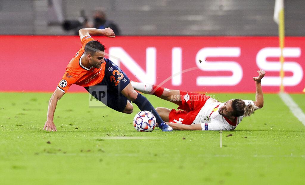 Jan Woitas Leipzig's Kevin Kampl, right, vies for the ball with Istanbul's Deniz Turuc, during a Group H Champions League soccer match between RB Leipzig and Istanbul Basaksehir at the RB Arena in Leipzig, Germany, Tuesday Oct. 20, 2020. (Jan Woitas/dpa via AP)