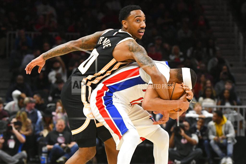 John Amis Atlanta Hawks guard Jeff Teague, left, becomes entangled with Detroit Pistons guard Tim Frazier as a jump ball is called during the second half of an NBA basketball game Saturday, Jan. 18, 2020, in Atlanta. (AP Photo/John Amis)