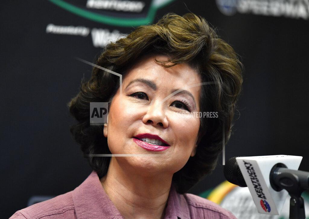 Timothy D. Easley Transportation Secretary Elaine Chao addresses the media before the NASCAR series auto race at Kentucky Speedway in Sparta, Ky., Saturday, July 13, 2019.. Chao will be the honorary race director for this evening's NASCAR race. (AP Photo/Timothy D. Easley)