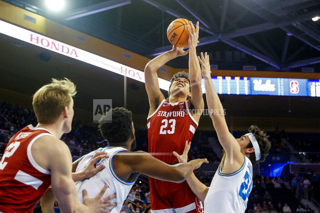 Ringo H.w. Chiu Stanford forward Brandon Angel (23) shoots between UCLA guard Jaime Jaquez Jr. (24) and forward Cody Riley (2) in the first half of an NCAA college basketball game Saturday, Jan. 29, 2022, in Los Angeles. (AP Photo/Ringo H.W. Chiu)