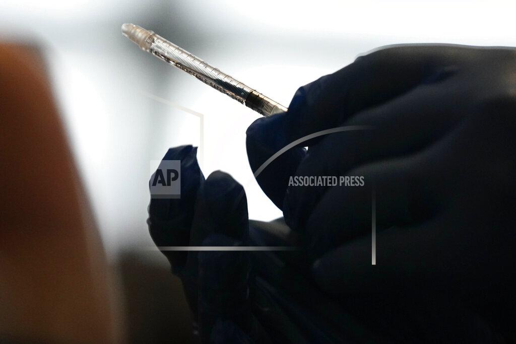 Brynn Anderson A retractable needle is seen after a person receives a vaccine at Mercedes-Benz Stadium on Thursday, March 25, 2021, in Atlanta. Gov. Brian Kemp said all Georgians 16 and older will be eligible to receive the COVID-19 vaccine. (AP Photo/Brynn Anderson)